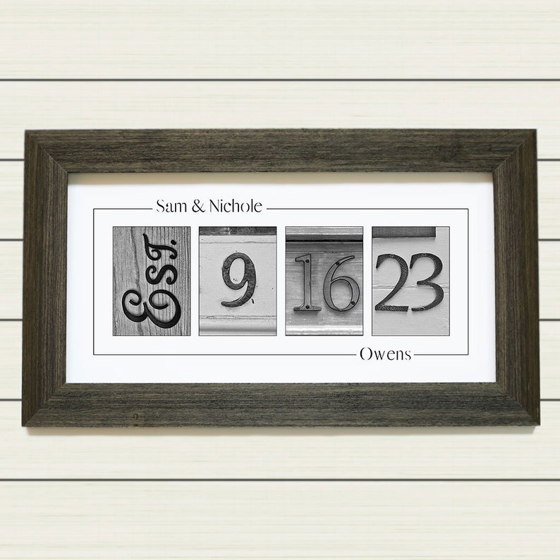 May include: A framed black and white photo with the personalized first names 'Sam & Nichole' and last name 'Owens' printed on the top and bottom of the photo. The photo contains the letters 'Est' and the numbers '9-16-23' to represent the wedding date, printed in black and white on a white background.