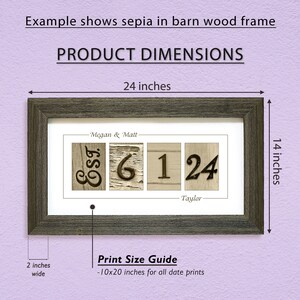 May include: A framed print with a rustic wood frame in a sepia tone. The print features a date, "6.1.24", with the names "Megan & Matt" and "Taylor" above and below the date. The print measures 10 inches by 20 inches and is framed in a 14 inch by 24 inch frame.