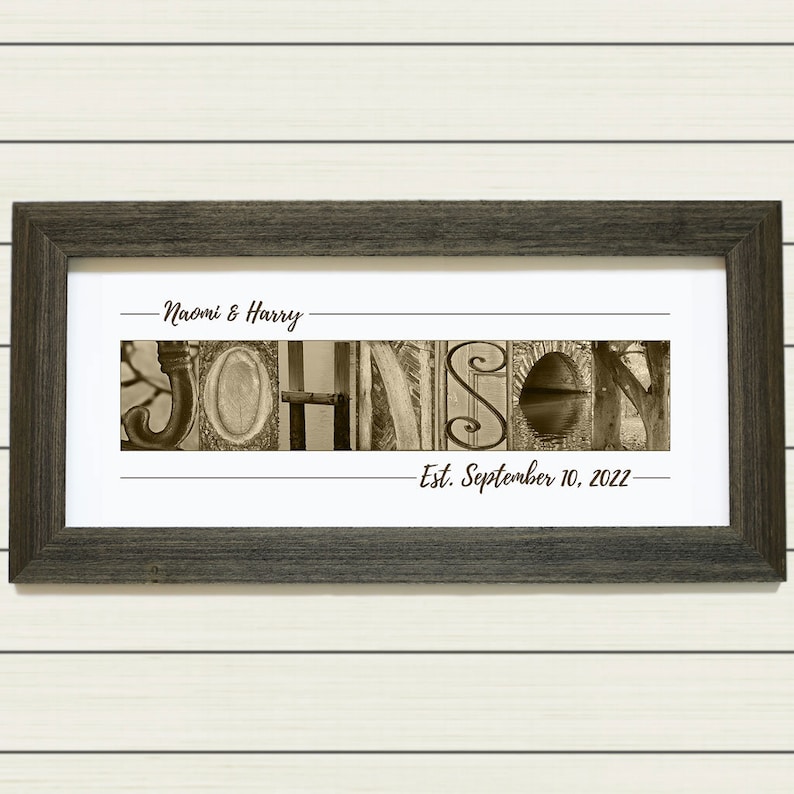 May include: A framed sepia-toned photo with the last name "JOHNSON" spelled out in a unique font using different images. The names "Naomi & Harry" and the date "Est. September 10, 2022" are written in cursive above and below the name.