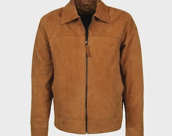 May include: A tan suede jacket featuring a full-length front zipper closure, a classic pointed collar, long sleeves with buttoned cuffs, and a straight hemline. The garment has a soft, matte texture and a consistent warm brown color throughout.