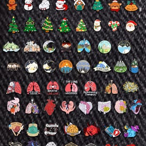 May include: A selection of enamel pins with diverse designs, such as Christmas motifs, camping scenes, anatomical lungs, and dice. The pins are brightly coloured and feature text like "Explore" and "How I Roll."