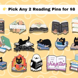 May include: A collection of enamel pins with book and cat themes. The pins feature phrases like "Book Babe," "Just one more chapter," and "Life is better with coffee, cats, and books." Other pins show a cat reading, a ghost reading, and a stack of books.