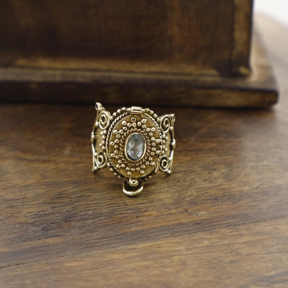 A fine handcrafted gold locket ring with a tiny hinged compartment — a genuinely rare, one-of-a-kind piece that merges Victorian keepsake tradition with wearable sculpture.