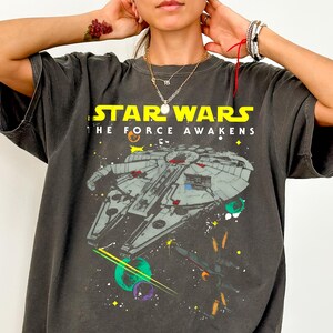 May include: A set of three ceramic mugs with a speckled, matte finish. Each mug features a different color: light blue, cream, and gray. The mugs have a simple, modern design and a comfortable handle.