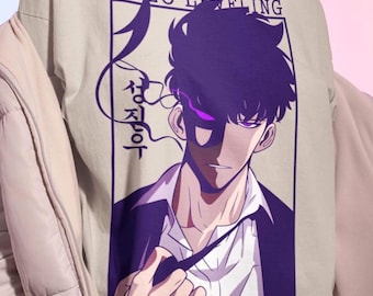 May include: Beige t-shirt featuring a purple and white graphic from the anime series "Solo Leveling." The design includes a character illustration with the text "SOLO LEVELING" and Korean characters.