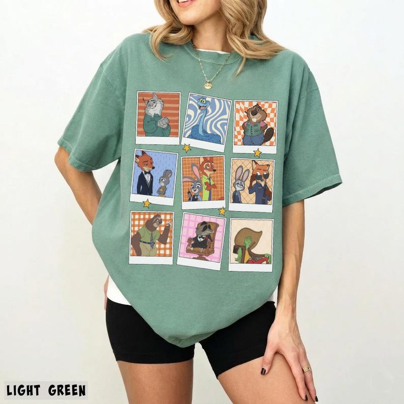 May include: Light green t-shirt featuring a grid of cartoon character images in polaroid-style frames. The images include various animal characters in different outfits and settings. The text "LIGHT GREEN" is at the bottom of the image.