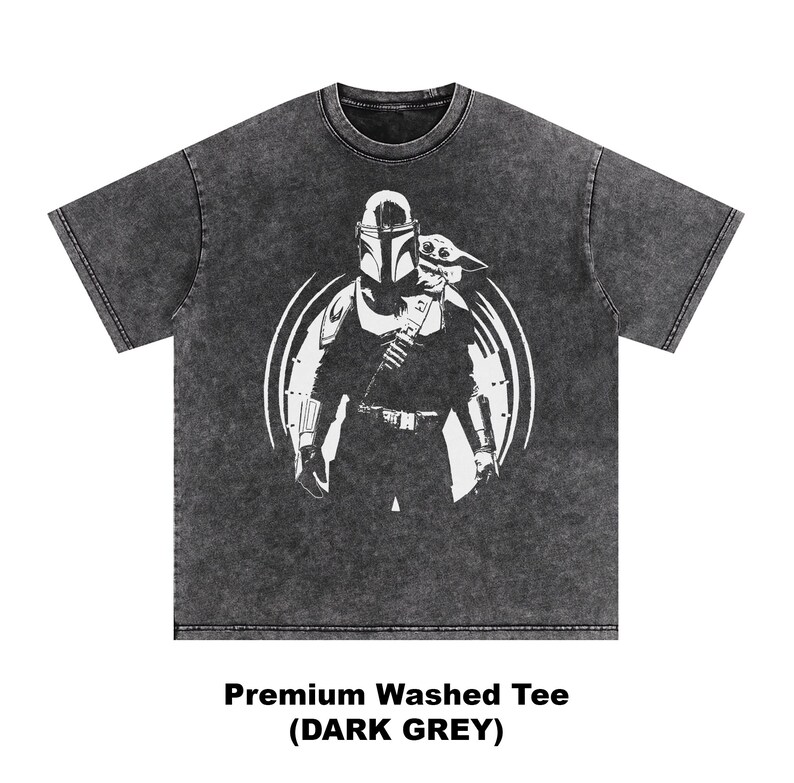 May include: Dark grey, washed tee shirt with a white graphic of a character from a popular science fiction series, with a helmet and a small creature. The text at the bottom reads "Premium Washed Tee (DARK GREY)".
