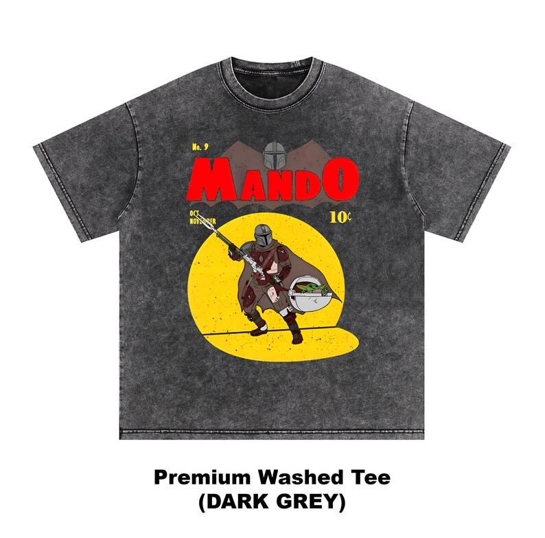 May include: Dark grey premium washed tee featuring a comic book style illustration of The Mandalorian with Grogu. The word "MANDO" is in large red letters, with the text "No. 9" and "10&cent;" above the illustration. The shirt's text reads "Premium Washed Tee (DARK GREY)".