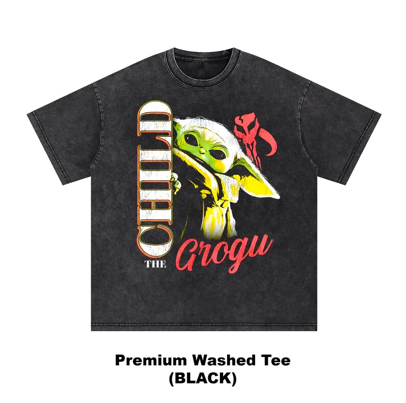 May include: Black washed tee featuring a graphic of Grogu, also known as The Child, from The Mandalorian. The design includes the words "CHILD" and "Grogu" in a stylized font, with Grogu's image in the center. The shirt is a premium washed tee.