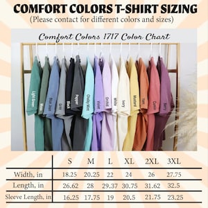 Op de afbeelding: Een kleurenkaart voor Comfort Colors T-shirts, met kleuren zoals Lichtgroen, Blue Jean en Berry. De kaart bevat maatvoering, met breedtes van 46,35 cm tot 70,49 cm, lengtes van 67,62 cm tot 82,55 cm en mouwlengtes van 41,28 cm tot 59,05 cm.