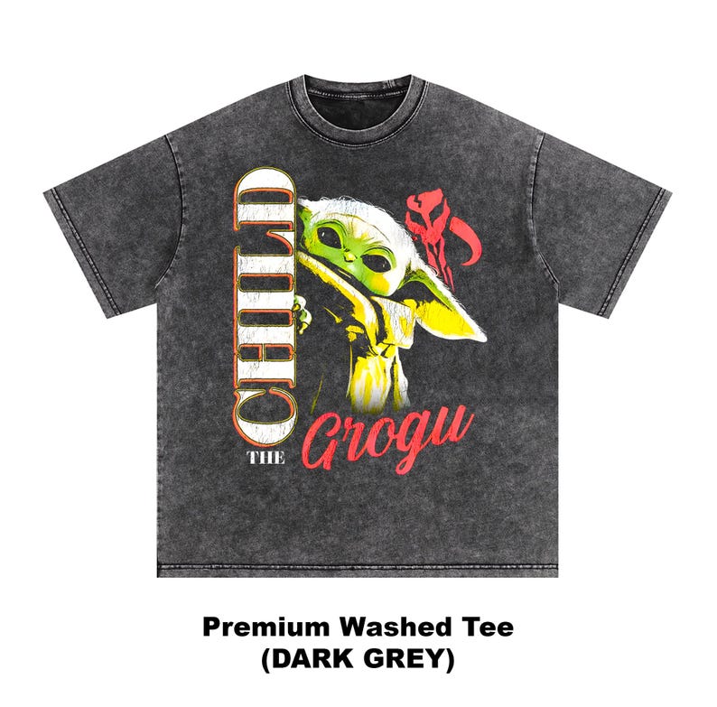 May include: Dark grey premium washed tee featuring a graphic of Grogu, also known as The Child, from The Mandalorian. The design includes the words "THE CHILD" and "Grogu" in a distressed style. The shirt is a dark grey color.