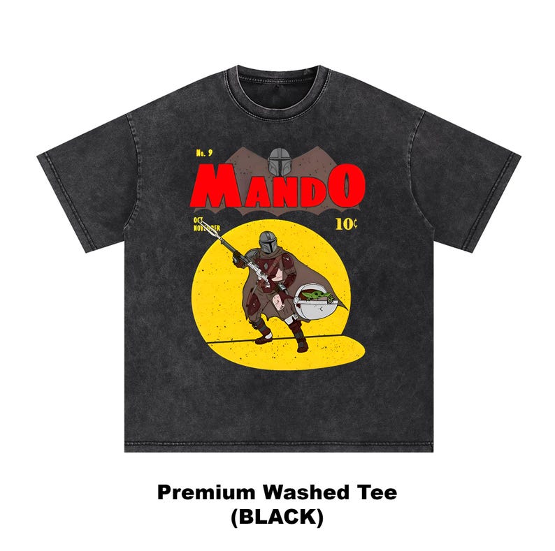 May include: Black washed tee featuring a comic book style graphic of The Mandalorian holding a spear and Grogu. The word "MANDO" is in large red letters above the illustration. The shirt also has the text "No. 9" and "10&cent;".