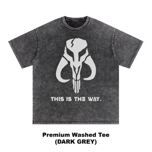 May include: Dark grey t-shirt with a white graphic of a horned skull and the text "THIS IS THE WAY." The shirt is labeled "Premium Washed Tee (DARK GREY)."