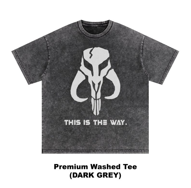 May include: Dark grey t-shirt with a white graphic of a horned skull and the text "THIS IS THE WAY." The shirt is labeled "Premium Washed Tee (DARK GREY)."
