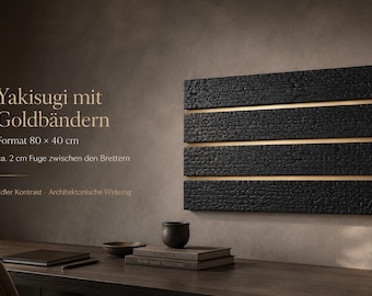 May include: A rectangular wall art piece with a charred wood appearance, featuring horizontal gold bands. The artwork is approximately 80 cm by 40 cm. Text on the image reads "Yakisugi mit Goldbändern".
