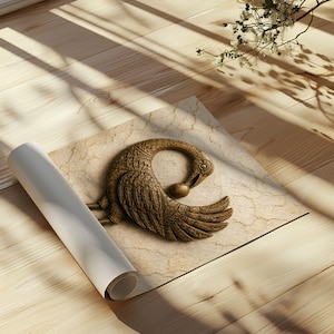a decorative bronze sculpture of a swan resting on a wooden surface.