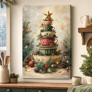 May include: A vertical canvas print depicting a stack of ceramic bowls and mugs arranged in a Christmas tree shape, topped with a gold star. The stack is surrounded by pine branches, red berries, pinecones, and small glowing fairy lights.