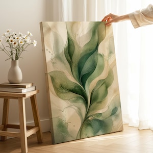 May include: A rectangular canvas print featuring an abstract botanical design with flowing, layered leaf shapes in shades of forest green, sage, and cream. The artwork displays fine, intricate line work and soft watercolor-style washes.