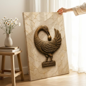 A person's hand is reaching towards a large, ornate wall sculpture depicting a bird, which is mounted on a beige wall.