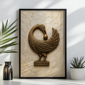 a framed picture of a bird, possibly a goose, with a stone or marble background. The bird is depicted in a detailed and ornate manner, with a beak and a ball in its mouth. The picture is placed on a shelf, with a potted plant to the left and a small white vase to the right.
