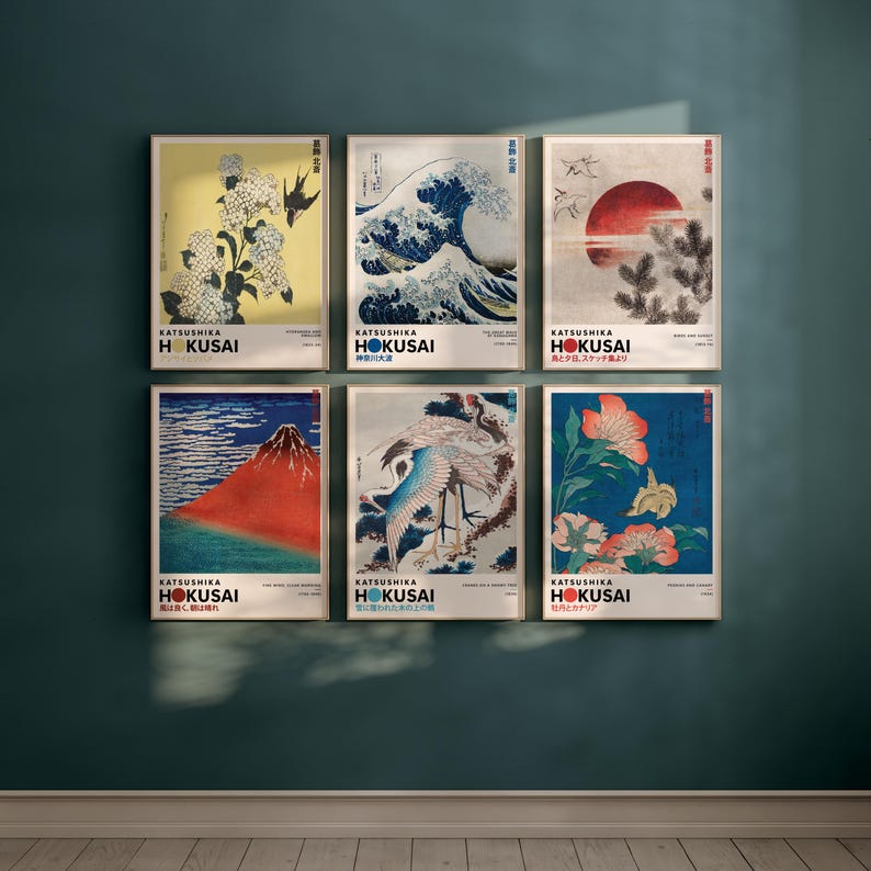 May include: A set of six rectangular wall art prints featuring Katsushika Hokusai artwork. Each print displays a unique Japanese-inspired illustration, including waves, birds, flowers, and mountains, with the text Katsushika Hokusai printed below.