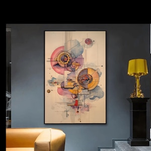 May include: Abstract art print featuring a complex arrangement of gears and mechanical elements in shades of yellow, pink, and blue. The artwork is framed in black and hangs on a gray wall, with a gold lamp and a yellow sofa visible.