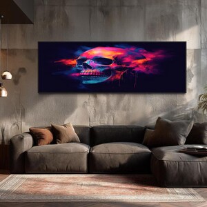 May include: A rectangular wall art piece featuring a human skull rendered in vibrant neon colors including pink, orange, and blue against a deep black background. The skull appears to be dissolving into colorful smoke or paint splatters.