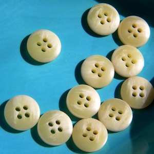 12 cream buttons - round plastic buttons - sewing supplies - sweater buttons - craft supplies