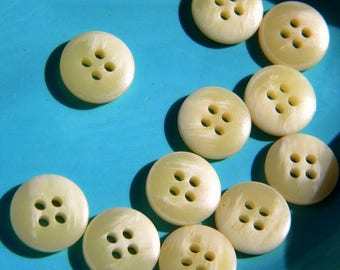 12 cream buttons - round plastic buttons - sewing supplies - sweater buttons - craft supplies