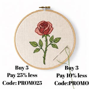 May include: A cross-stitch embroidery of a red rose with green leaves and stem, set in a circular wooden hoop. A metal needle with green thread is attached to the fabric. Text reads: Buy 5 Pay 25% less Code: PROM025 and Buy 3 Pay 10% less Code:PROMO.