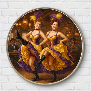 May include: Round framed print of two can-can dancers in a cabaret setting. The dancers wear yellow and purple dresses, black boots, and feathered headdresses. The background shows a bar with patrons.