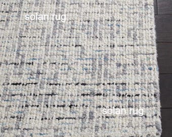 Alfombra abstracta de lana gris marfil, moderna, hecha a mano, con textura neutra para sala de estar, dormitorio y decoración del hogar.