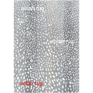 May include: A rectangular rug with a gray background and a pattern of white, irregular spots. The rug has the text "solah rug" in white letters in three places. The rug appears to be made of a soft material.