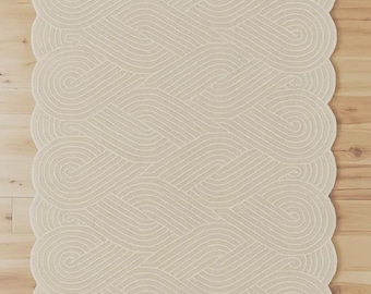 Alfombra de lana rosa tejida a mano de Anthropologie, disponible en tamaños de 5x8, 8x10 y 9x12 pies.