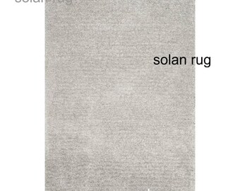 Alfombra de lana de lujo plateada con mechones hechos a mano, minimalista en color marfil, con textura neutra para dormitorio, estilo bohemio escandinavo.