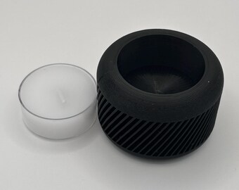 Portavelas para velas pequeñas, incluye vela y soporte.