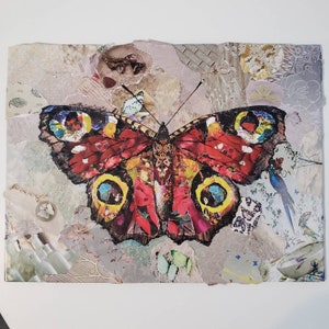 May include: A colorful collage featuring a large, red, black, and yellow butterfly with intricate details. The butterfly is surrounded by various textures and patterns, including floral motifs and geometric shapes.