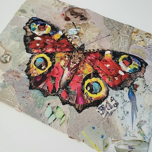 May include: A colorful collage featuring a large, intricately patterned butterfly with red, yellow, and blue accents. The butterfly is surrounded by smaller pieces of paper with floral and geometric designs.