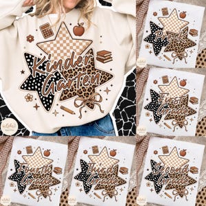 May include: A cream-colored sweatshirt featuring a graphic of three overlapping stars with checkered, leopard, and polka dot patterns. The design includes the text Kindergarten, an apple, a calculator, books, a pencil, and a bow.