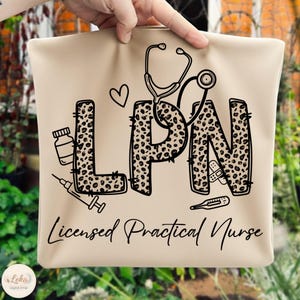 May include: Beige tote bag with the letters "LPN" in a leopard print design, a stethoscope, and medical icons. The words "Licensed Practical Nurse" are written below the letters in a script font.