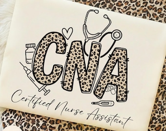 May include: A cream-colored t-shirt featuring a black graphic with the letters CNA filled with a leopard print pattern. The design includes a stethoscope, a syringe, a heart, a medicine bottle, and a thermometer, with the text Certified Nurse Assistant.