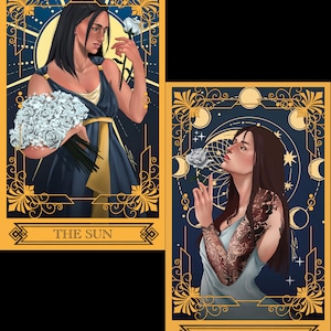 May include: Two rectangular tarot cards with gold borders on a dark blue background. The left card labeled THE SUN features a person in a navy dress holding a white rose bouquet. The right card labeled THE MOON shows a person with a patterned sleeve.
