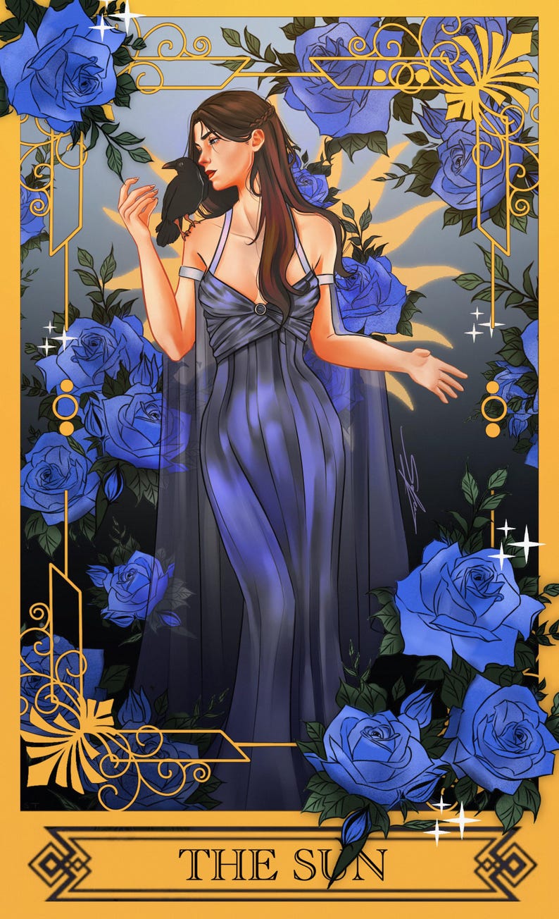 May include: A digital illustration of a person with long brown hair wearing a floor-length dark blue gown, standing amidst vibrant blue roses. A black raven rests on their shoulder. The frame is gold with the text THE SUN at the bottom.
