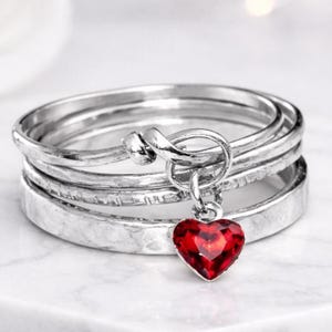 ruby ring garnet ring red crystal ring heart crystal ring charm crystal ring birthstone ring january birthstone ring romantic stone ring love stone ring passion stone ring deep red stone ring bright red stone ring dark red stone ring shiny crystal ring small crystal ring tiny crystal ring delicate stone ring fine crystal ring elegant crystal ring modern crystal ring minimal crystal ring simple crystal ring fashion crystal ring stylish crystal ring 0.5 ct ring half