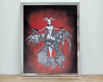 May include: Framed black and white illustration of a horned figure with outstretched arms and flowing, skull-adorned wings against a red and black background. The artwork is displayed in a silver frame.