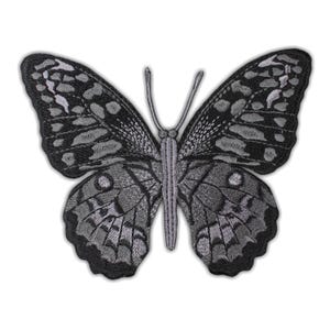 May include: An embroidered butterfly patch in shades of grey. The patch showcases detailed patterns on the wings and body, with a design suitable for sewing or ironing onto clothing or fabric. The patch is in a butterfly shape.