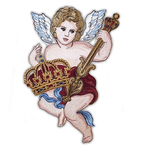 May include: An embroidered patch featuring a cherub with light brown hair and white wings. The figure holds a gold scepter topped with a small crown and supports a large, ornate gold crown with red and blue accents against a dark red cloth.