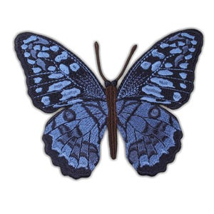 May include: Embroidered butterfly patch with a detailed design in shades of blue and navy. The butterfly has a brown body and antennae. The wings display intricate patterns, ideal for adding to clothing or accessories.