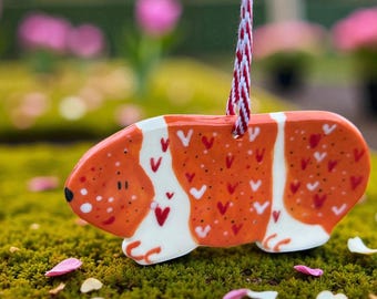 Ceramic Guinea Pig hanging decoration.
