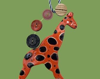 Handmade Ceramic Giraffe Decoration with buttons .